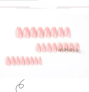 Detailed flat lay of 24 pieces pink gradient press-on nails with crystal rhinestones