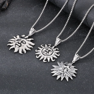 Detailed trio of silver stainless steel sun god pendants with intricate face relief