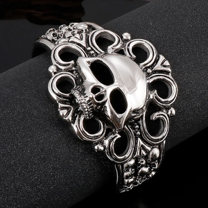 Macro view of gothic skull cuff bracelet with baroque engraving on stainless steel