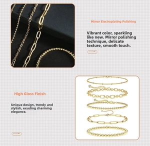 Macro shot of gold layered bracelet set showing polished Cuban and paperclip link chains