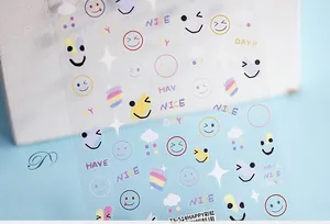 Macro view of rainbow nail art stickers featuring colorful smiles and clouds TS-514