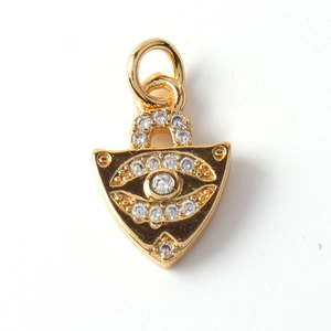 Detailed view of gold-plated evil eye lock pendant with micro-pave white zircon stones