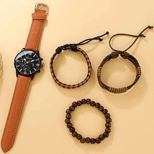 Detail of men's business watch with black dial and three vintage braided leather bracelets