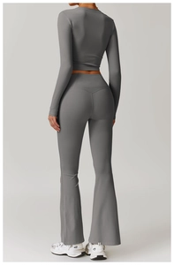 Detail showing high-waisted flare yoga leggings and slim fit long sleeve sports top