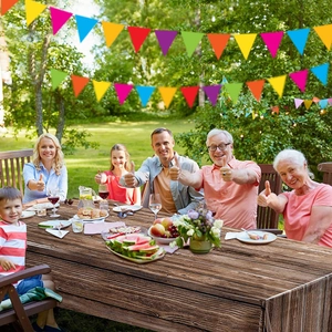 Outdoor picnic scene showing natural wood grain texture tablecloth and colorful flags