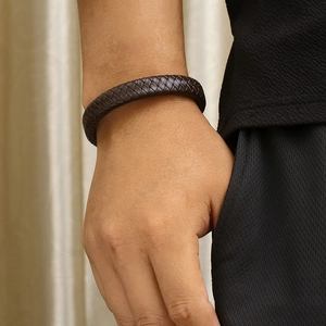 Men's dark brown woven leather bracelet with a secure magnetic stainless steel clasp