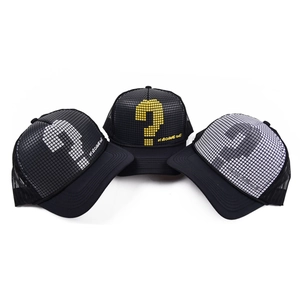 Three pixelated question mark trucker hats with breathable mesh and curved brims