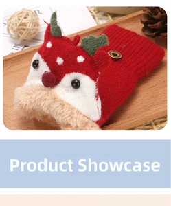Detail of red Christmas reindeer gloves with thick fleece lining and wooden button