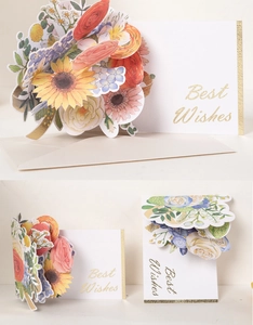 Detailed view of a 3D pop-up greeting card featuring a colorful floral bouquet and gold text