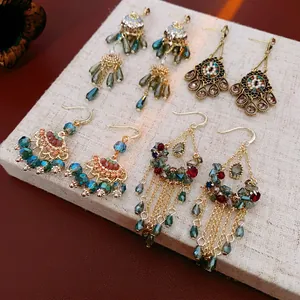 Bohemian retro gold tassel earrings set with colorful crystals and floral details