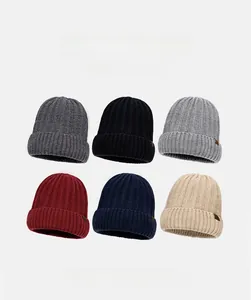 Detailed grid view of ribbed knit beanies in six assorted colors with leather patches