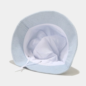 Light blue terry cloth bucket hat featuring adjustable inner drawstring and soft lining
