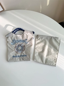 Detail view of nylon organizer insert with high-quality embroidery and zip pouch