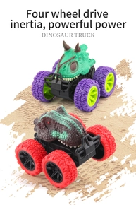 Detail of colorful dinosaur monster trucks with large off-road tires and inertia drive