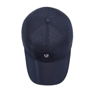 Quilted navy blue baseball cap with ear protection and warm lining for men