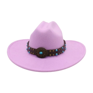 Close-up of pink wool fedora featuring a leather band with turquoise and copper studs