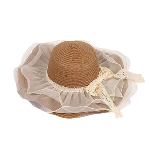Summer wide brim straw sun hat with elegant white lace bow and ruffled mesh trim