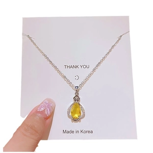 Yellow teardrop zircon perfume bottle pendant necklace with silver chain on card