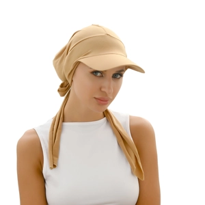 Women's beige turban hat with pleated brim and bow tie, ideal for summer sun protection