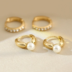 Elegant gold pearl hoop earrings and rhinestone ear buckles with high polish finish