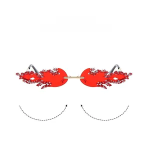 Detail of red rimless flame sunglasses with sparkling silver rhinestones and gold temples