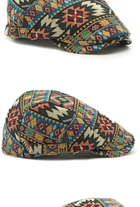 Detailed close-up of ethnic jacquard weaving and metal buckle on the flat top cap