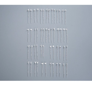 Detailed view of S999 sterling silver long drop earrings with A-Z alphabet pendants