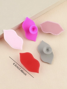 Lip-shaped silicone exfoliant brush detail showing the textured surface and 6.3cm size