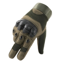 Detail view of tactical gloves featuring military green nylon and hard knuckle guards