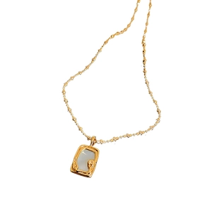 Elegant gold titanium steel necklace featuring a rectangular pearl fish tail pendant
