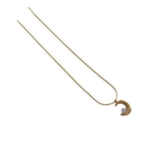 Minimalist gold moon pendant necklace with a clear crystal on a thin chain, studio shot