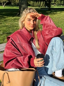 Retro oversized burgundy faux leather jacket for women styled with casual street denim