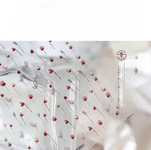 Macro shot of transparent floral nail stickers with red flower pattern model KX061
