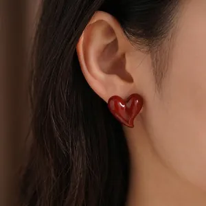 Elegant gold-plated heart-shaped stud earrings in deep vintage red for women