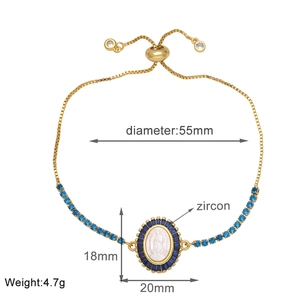 Detail of adjustable gold-plated bracelet with blue zircon and Virgin Mary pendant