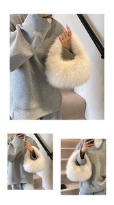 Close-up of white plush faux fur handbag with elegant crescent moon shape for women