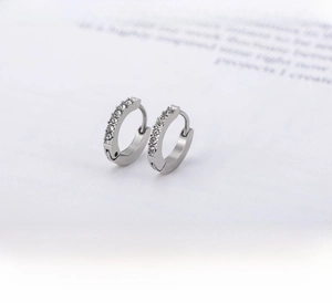 Macro view of steel hoop earrings with double row cubic zirconia and product dimensions
