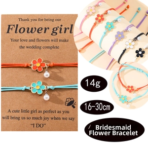 Detail showing colorful flower charms and pearl pendants on adjustable woven bracelets