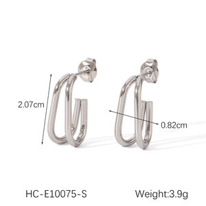 Macro view of silver U-shaped stainless steel earrings with dimensions 2.07cm and 0.82cm