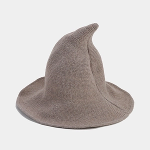 Detail view of khaki knitted wizard hat featuring fine ribbed texture and a curved tip