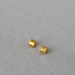 Macro detail of high-quality gold-plated brass bullet stoppers for DIY jewelry making