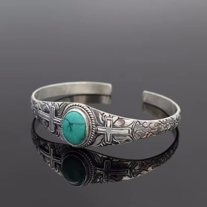 Vintage bohemian turquoise cuff bracelet with cross engraving and silver finish