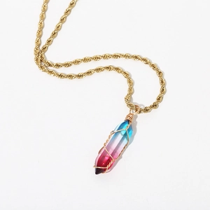 Detail of bohemian gold rope chain necklace with a triple-color gradient crystal pendant