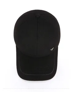 Top view of a black winter baseball cap featuring a premium silver triangle buckle detail