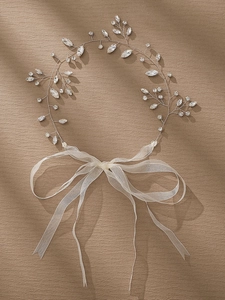 Detail of bridal ribbon headband featuring silver filigree, marquise rhinestones and tulle