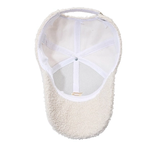Beige lamb wool baseball cap with G embroidery, interior view showing soft lining and tag