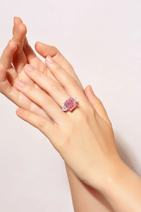 Close-up of s925 silver ring featuring a pink square-cut zircon and drop-shaped gems