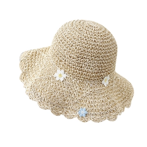 Handmade straw sun hat with wide wavy brim and sweet daisy flower decorations for women