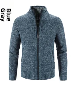 Close-up of blue grey knit cardigan featuring standing collar and metal zipper detail