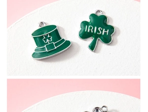 Detail of green enamel Irish shamrock and hat alloy charms for DIY jewelry making